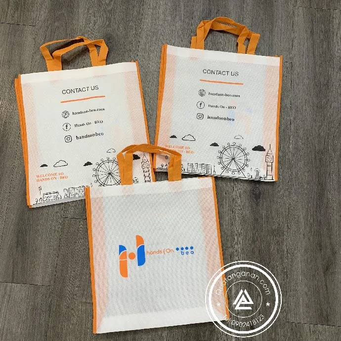 TÚI VẢI KHÔNG DỆT MÀU TRẮNG PHỐI CAM IN LOGO HANDS ON